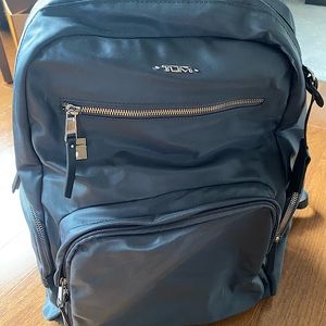 TUMI Carson Backpack.  Charcoal gray.  Silver hardware.  Fits 15” laptop.